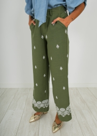 LINEN TROUSERS WITH KHAKI EMBROIDERY DETAILS